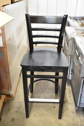 Black bar height ladder back chair by Lancaster Table & Seating, brand new, scratch and dent condition, wooden seat.