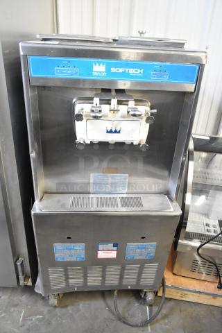 Taylor 754-27 stainless steel commercial soft serve ice cream machine, two flavors with twist, on casters, 208-230V, 1 phase.
