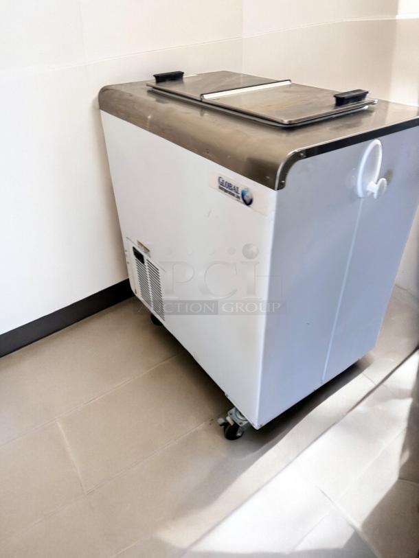 Like-new Global 2SF ice cream chest freezer, NSF certified, fully tested, stainless steel top, caster wheels, USA-made.