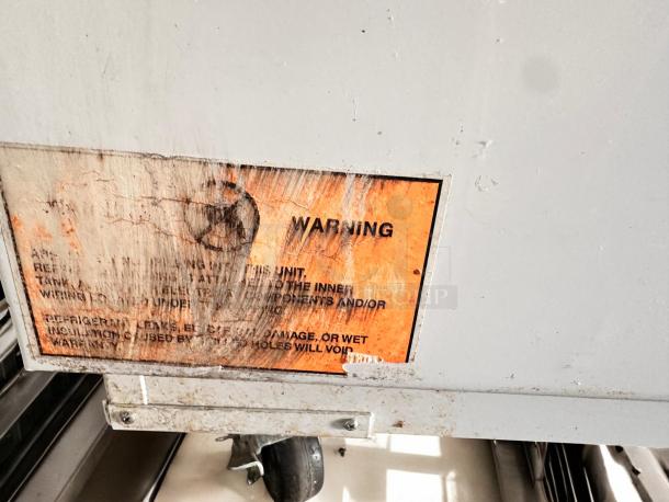 Global 2SF low temp ice cream chest freezer, like-new, NSF certified, fully tested, warning label visible, made in USA.