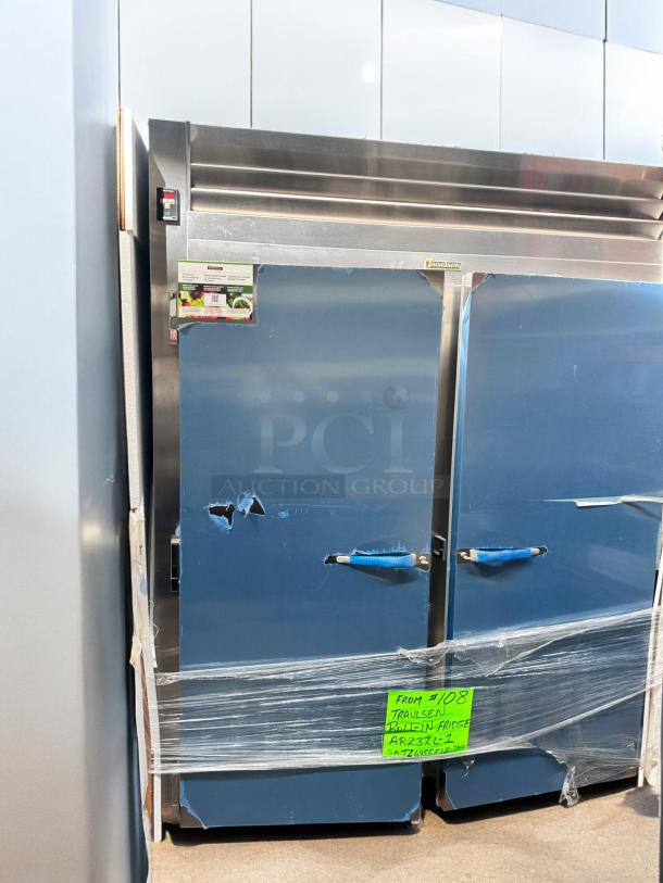 Brand new Traulsen AR23ZL-1 roll-in refrigerator, left hinge solid door, factory sealed, 115V, full-size, stainless steel.