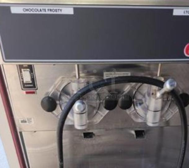 SaniServ 424 Twin Twist Soft Serve Ice Cream Machine in outstanding condition, showcasing control panel and nozzles.