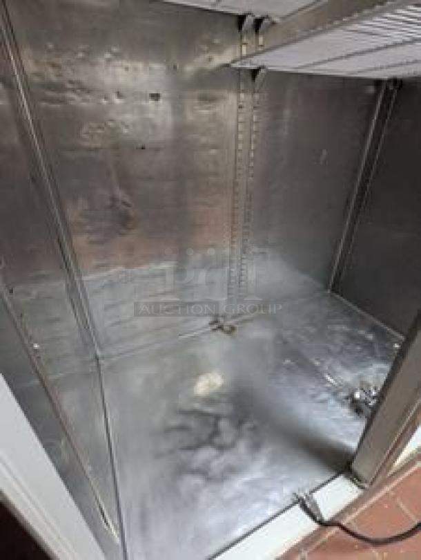 Alt text: Everest ESR2 two-door reach-in refrigerator interior, stainless steel, excellent condition, shelves visible, 115V.