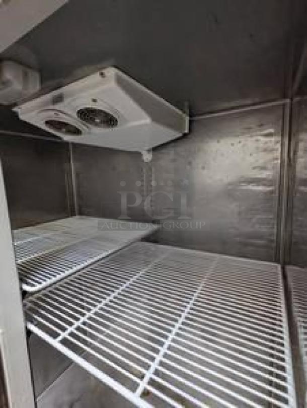 Everest ESR2 two-door reach-in refrigerator, outstanding condition, stainless steel interior, removable wire shelves, 115V.