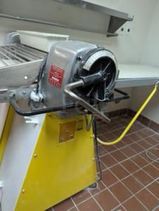 Rondo commercial dough sheeter, floor model in superb condition. Features manual controls and safety labels. Fully tested and operational.