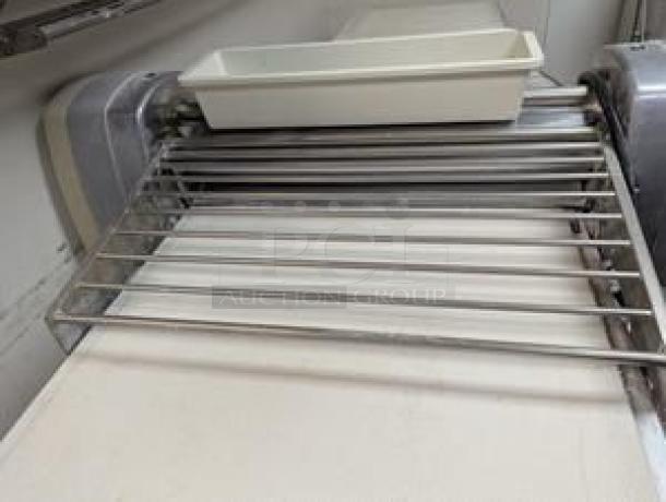 Rondo floor model commercial dough sheeter in superb condition, featuring stainless steel rollers and tray. Fully tested and working.