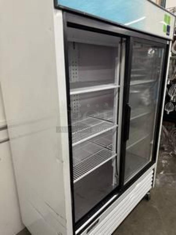 Beverage-Air sliding glass door display refrigerator, superb condition, 115V, shelves intact, for commercial use.