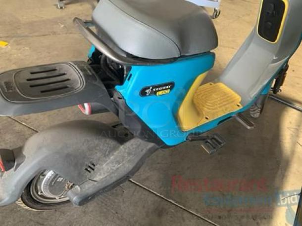 Segway Ninebot C80 electric moped scooter in superb condition with 115V charger; features blue body, black seat, yellow footrest.