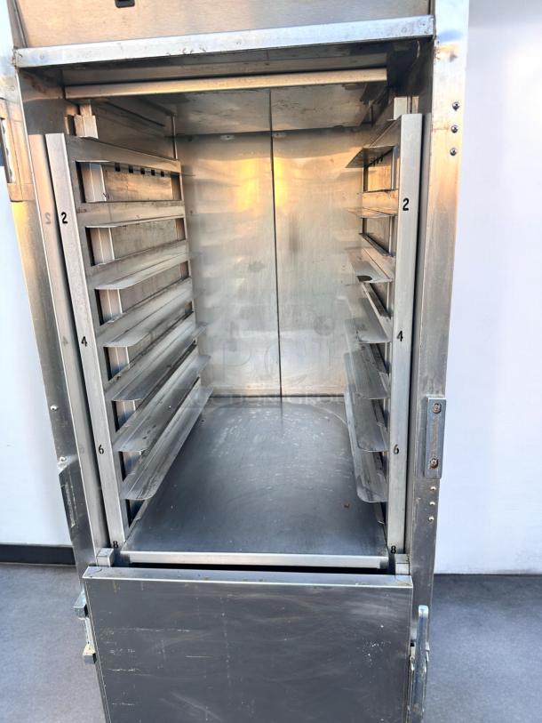 FWE TST-16-EPL Heated Holding Cabinet, stainless steel, excellent condition, interior shelves visible, 220V power.