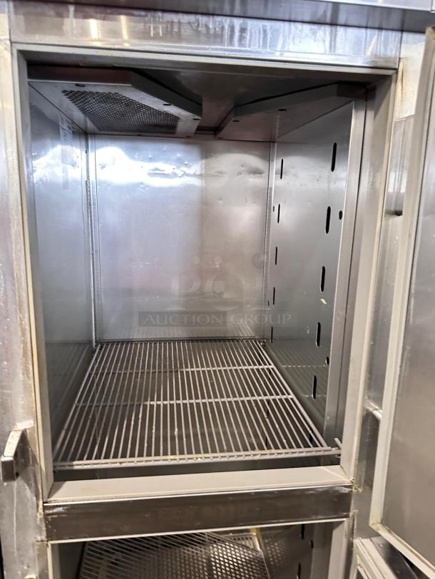 True STM1R-2HS reach-in refrigerator with half doors. Stainless steel interior, excellent condition, fully tested, 115V.