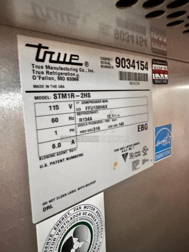 True STM1R-2HS Reach-In Refrigerator, half doors, 115V, model label visible with serial number 9034154, Energy Star certified.