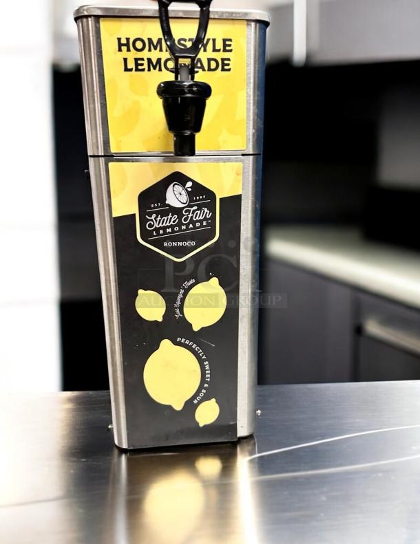 Newco FPM-1 Tomlinson Beverage Dispenser in superb condition. "State Fair Lemonade" branding visible. Fully tested and working.