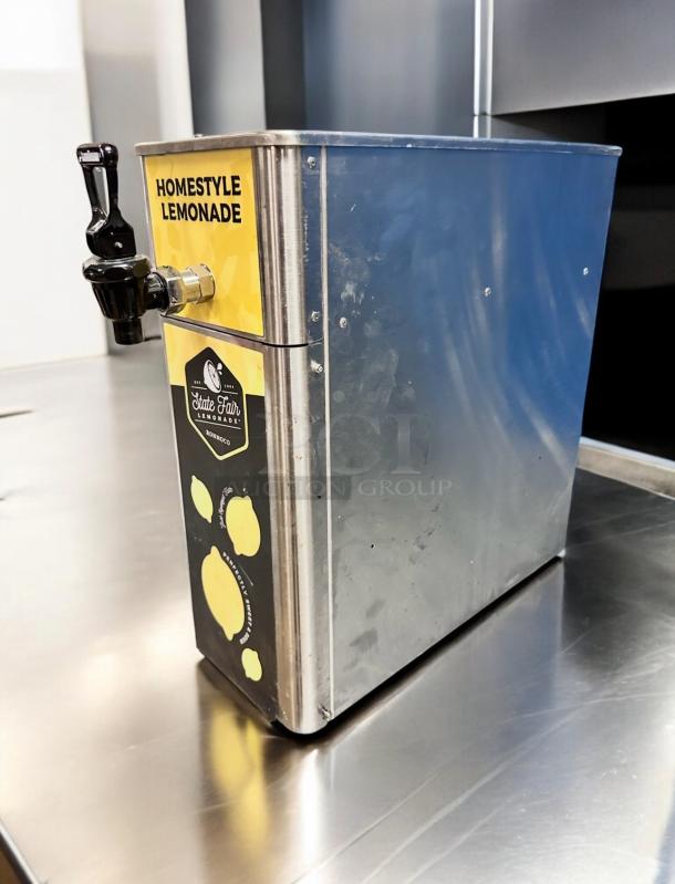 Newco FPM-1 Beverage Dispenser with Tomlinson spigot in superb condition. Yellow "Homestyle Lemonade" label visible.
