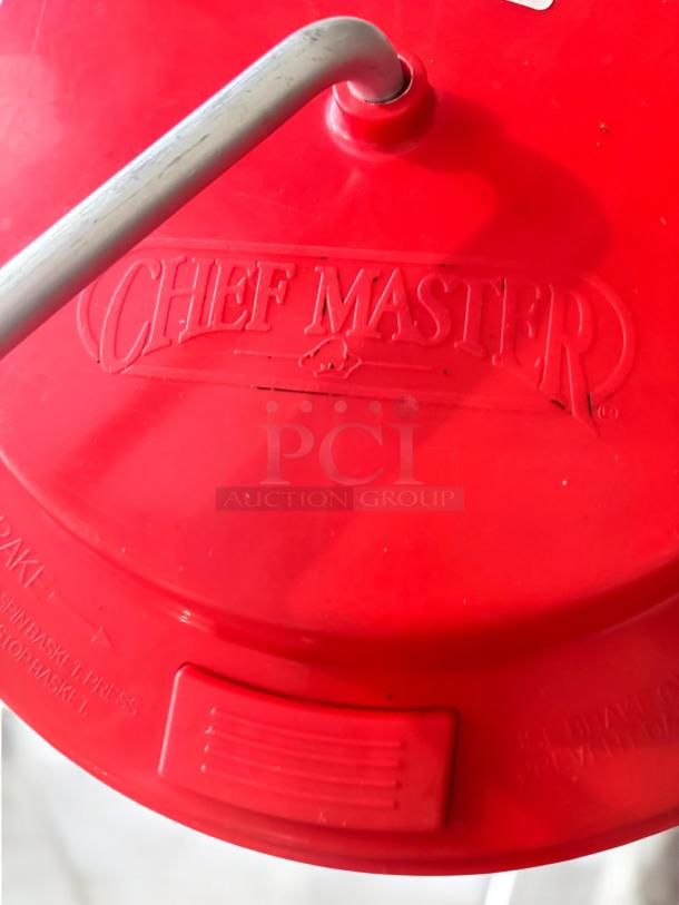 Red Chef Master manual mop bucket with hand-crank wringer, like-new condition, heavy-duty plastic, logo embossed on lid.