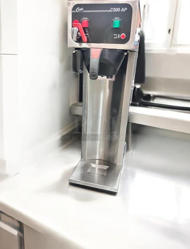 Curtis C500 AP airpot coffee brewer in great condition, fully tested, with 115V power, stainless steel finish.