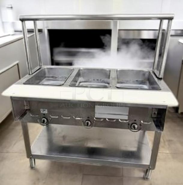 3-Well Electric Steam Table with sneeze guard, in outstanding condition; includes undershelf, fully tested and working.