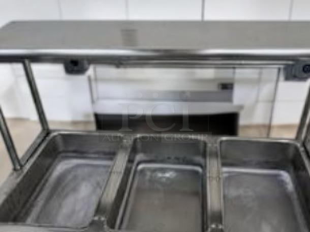 3-Well Electric Steam Table with overhead sneeze guard, undershelf, in outstanding condition. Fully tested and working.