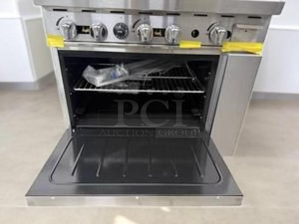 Atosa AGR-4B24G gas range with 4 burners, 24" griddle, and oven in outstanding condition. Natural gas, fully tested, working.