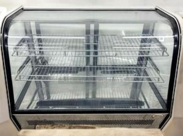 Omcan 17167 refrigerated countertop display case in outstanding condition, 115V. Featuring glass exterior and multiple shelves.