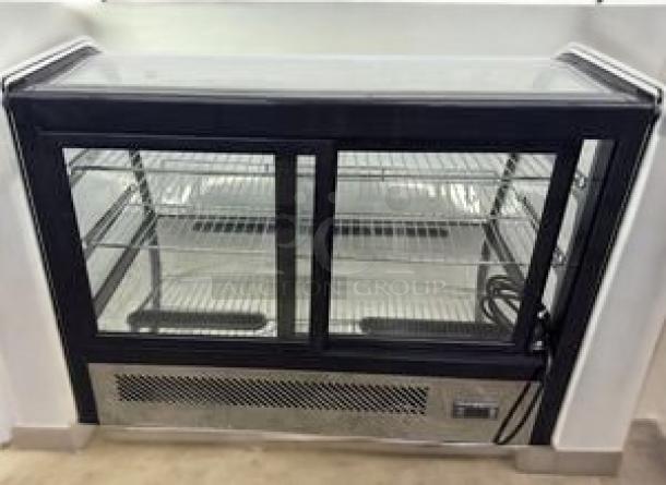 Omcan 17167 refrigerated countertop display case, excellent condition, glass doors, adjustable shelves, 115V, fully tested.