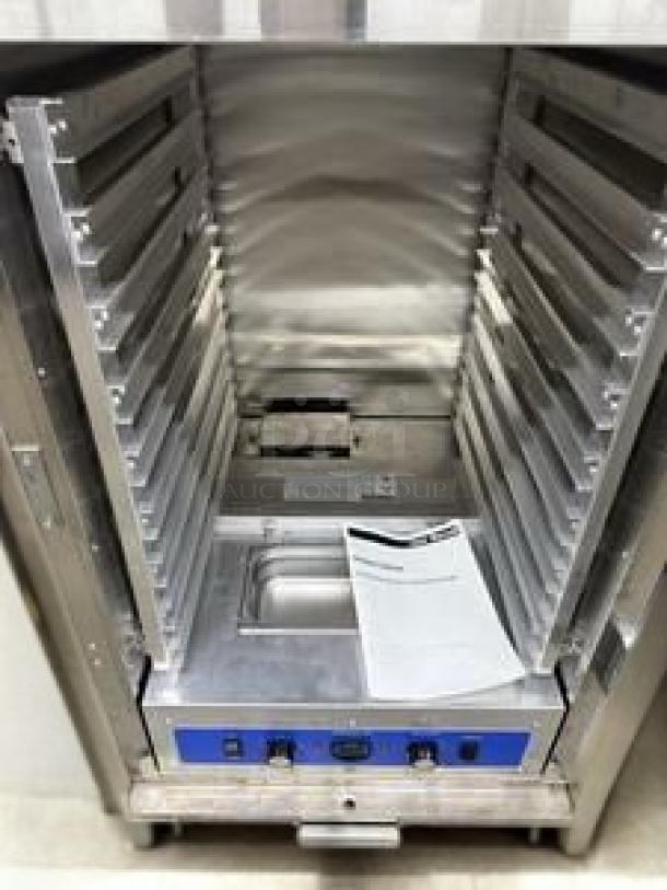 CookRite full-size electric holding cabinet; excellent condition, includes manual, multiple shelves, and controls; 120V.