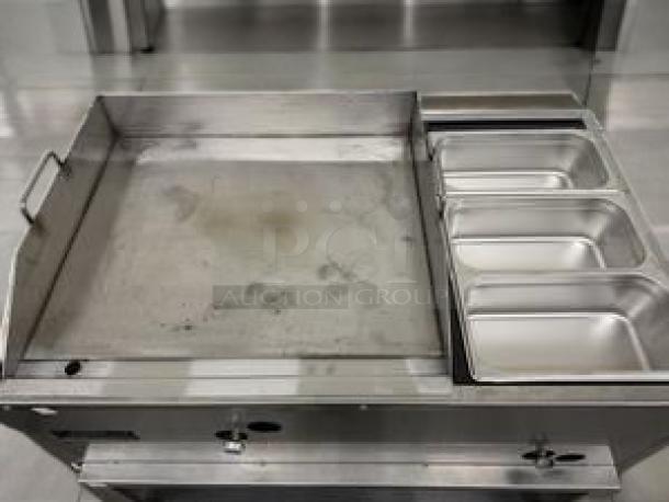 Commercial 36" gas griddle with three steam table wells, in outstanding condition. Stainless steel, fully tested and working.