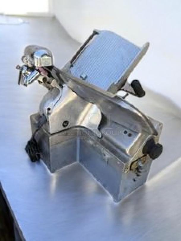 Globe Commercial Heavy-Duty Meat Slicer, 115V, excellent condition, featuring automatic/manual operation, tested and working.