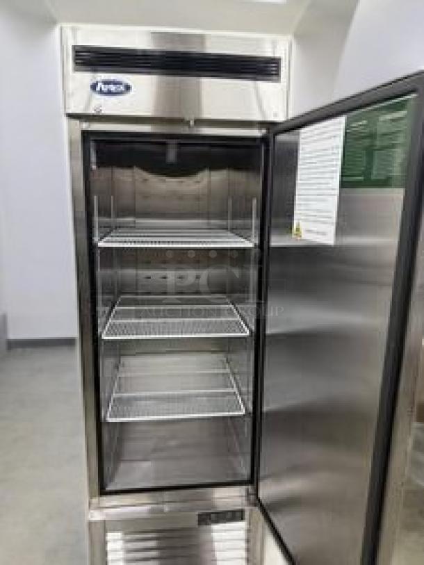 Alt Text: Atosa MBF8501GR single door reach-in refrigerator, superb condition, open door showing shelves, 115V, fully tested.