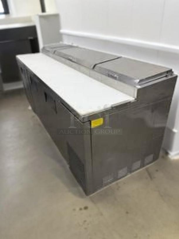 True TSSU-72-18 3-Door Mega Top Sandwich/Salad Prep Table in outstanding condition; 72-inch length, features cutting board, 115V.