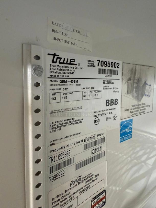 Alt text: "True GDM-43EM Merchandiser Refrigerator labels, showing model number, voltage, and Energy Star certification."