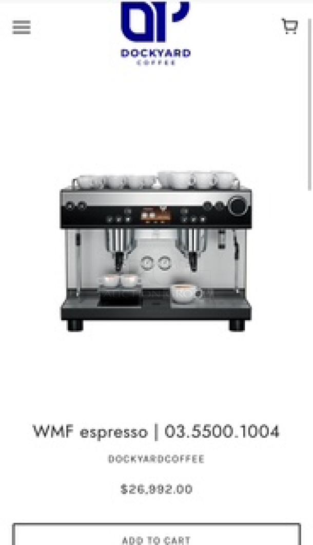 WMF Espresso Model 30.5500 with dual grinders for regular and decaf, two steam wands, hot water outlet, and heatable cup storage.