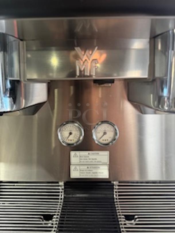 WMF Espresso Model 30.5500 coffee machine, featuring dual grinders, hot water outlet, and steam wands. Excellent condition.
