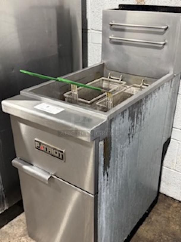 Patriot PT-F4-NG natural gas fryer, 45-50 lb. capacity, stainless steel pot, 15.5” wide, visible connectors. Used condition.