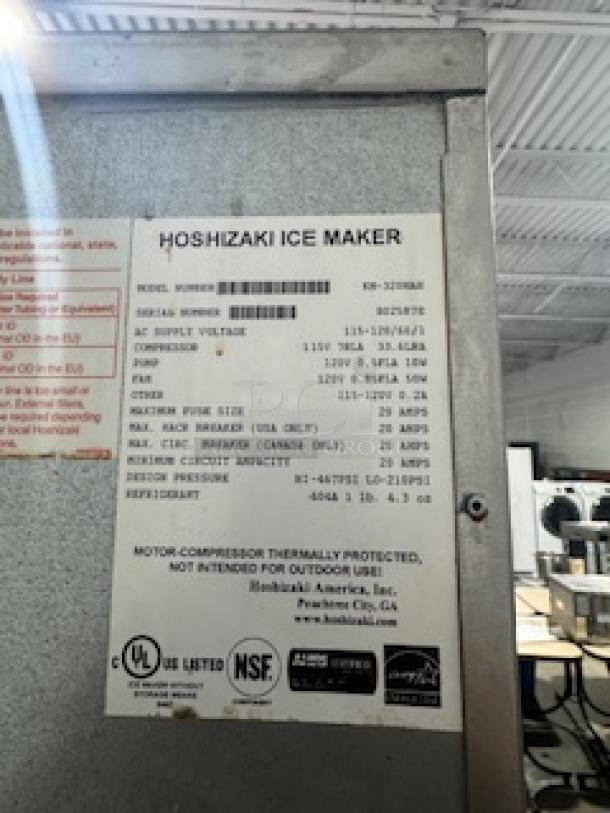 Hoshizaki KM-320MAH 556 lb. Slim-Line Crescent Cube Ice Machine, 300 lb. storage, air cooled, 115v, full size, label shown.