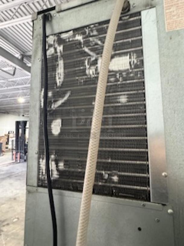 Hoshizaki KM-320MAH Ice Machine back panel, showing air-cooled coils. Some wear visible; for 556 lb. ice production.