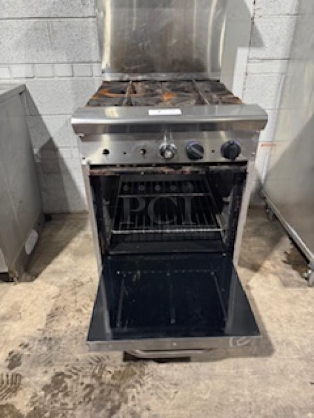 Tri-Star TSR-4 24" commercial gas range, 4 heavy-duty burners, 33,000 BTUs each, with storage base, chrome rack, used condition.