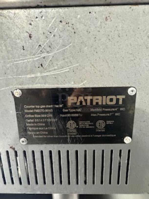 Patriot charbroiler model FMECTC-36/NG, 30,000 BTU per burner, 3/4" gas inlet, stainless steel, gas type NAT, in good condition.