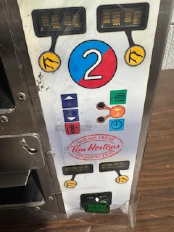 Meister Cook DMW-22-TDL heated holding unit with control panel, visible labels, dual chambers; Tim Hortons branding evident.