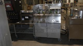 Frymaster double electric deep-fryer, model 22EF-SP, 208/240v, metal finish, with two fry baskets on wheels.