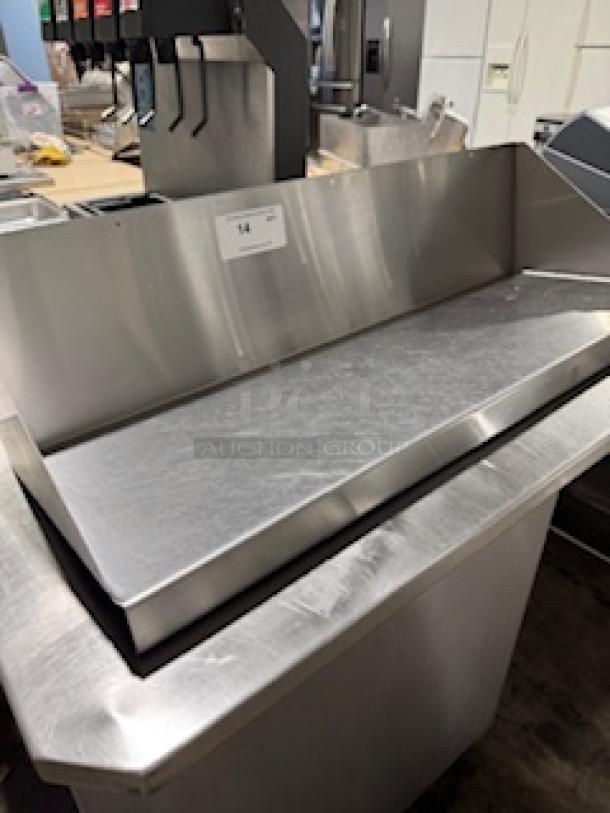 Heavy-duty 36" stainless steel wall shelf with raised edges, in good condition, ideal for kitchen use.
