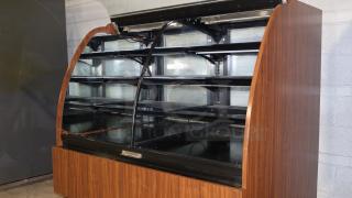 Structural Concepts H5C5650LR refrigerated display case, curved glass, wood exterior, self-contained, 120v, good condition.