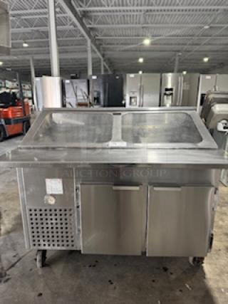 Refrigerated sandwich prep table with clear lid and dual stainless steel doors in good condition, ideal for commercial kitchens.
