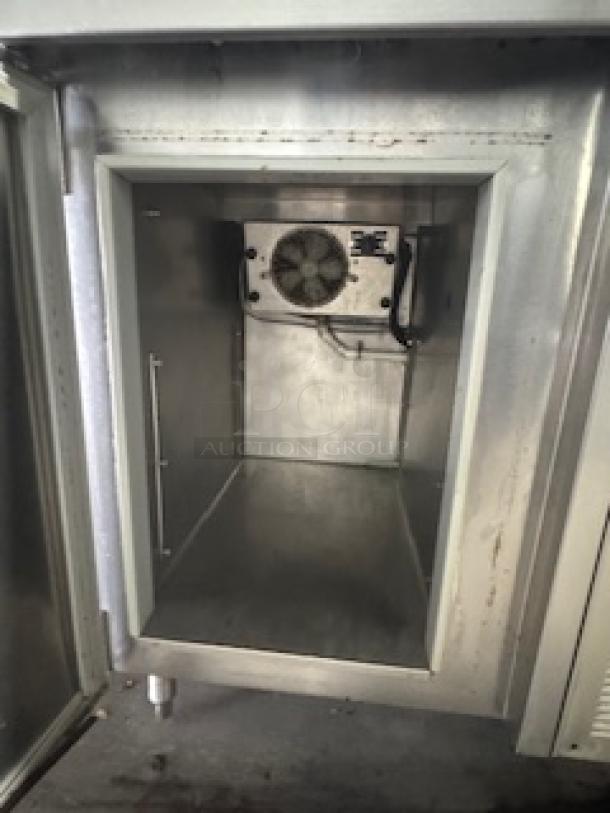 Three compartment stainless steel sink with dual-door cooler, in good condition, ideal for restaurants and bars.