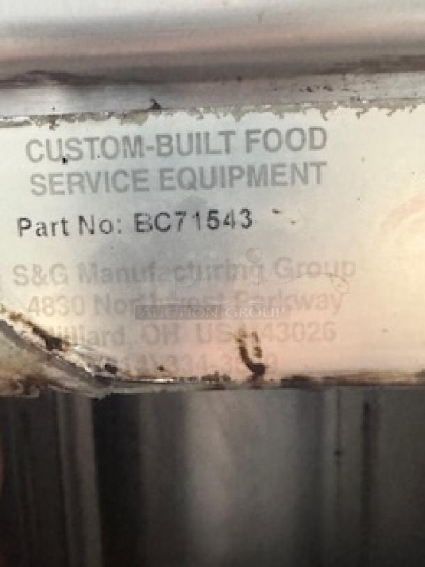 S&G Manufacturing BC7-1543 food service equipment label, showing part number and address. Appears slightly worn.