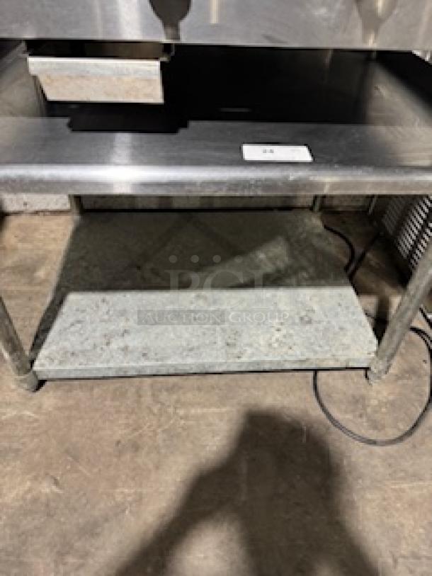 Regency 30" x 36" stainless steel equipment stand with galvanized undershelf, 16-gauge, sturdy, used condition.