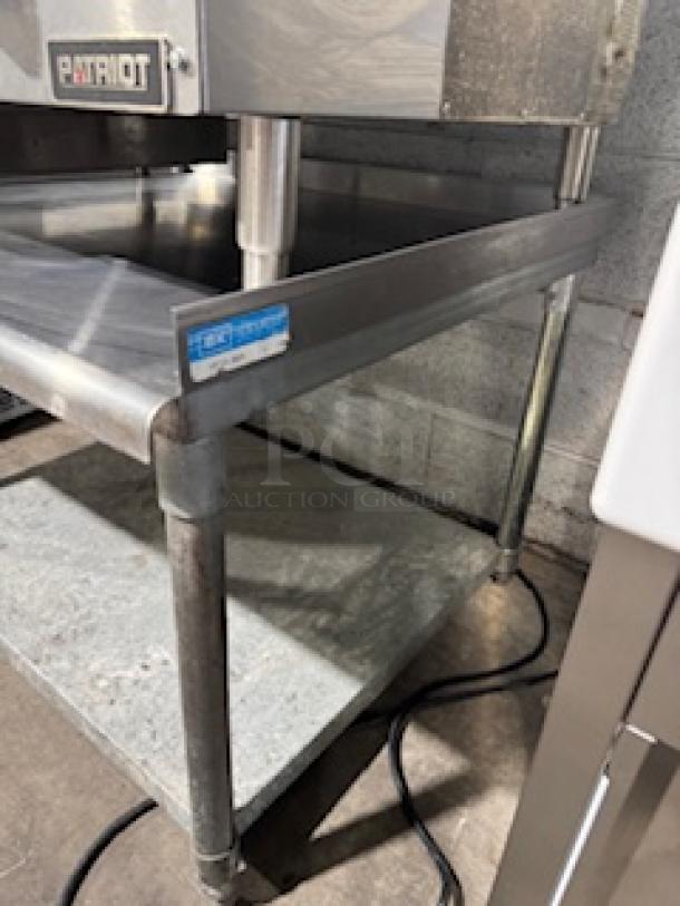 Regency 30" x 36" stainless steel equipment stand with galvanized undershelf, 16-gauge steel, visible minor wear, Patriot label.