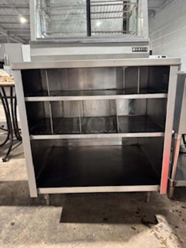 NICE CUSTOM stainless steel table by S&G Manufacturing, two open shelves, durable construction, excellent condition.