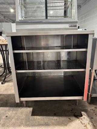 NICE CUSTOM stainless steel table by S&G Manufacturing, two open shelves, durable construction, excellent condition.