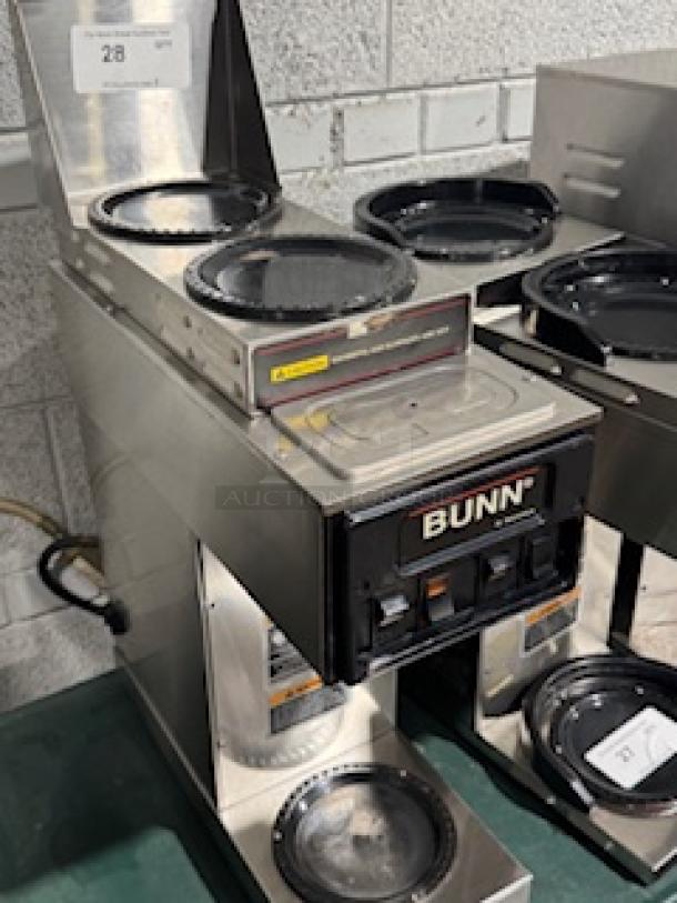 BUNN ST-35 coffee brewer with LCD, featuring 2 upper and 1 lower warmer. Stainless steel, tested and working condition. 120V.