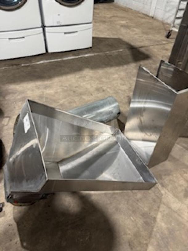 Stainless steel Proline wall-mounted range hood, ducted, 900/1200 CFM capacity, displayed with vent components.